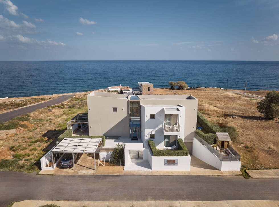 Birds Eye view from the entire villa grounds, featuring parking spots & playground. Ideal for loved ones to gather for the ultimate holiday break in Panormos, Rethymno.